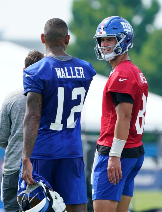 Jul 27, 2023; East Rutherford, NJ, USA;  New York Giants tight end Darren Waller, left, and quarterback Daniel Jones talk on day two of training camp at the Quest Diagnostics Training Facility. Mandatory Credit: Danielle Parhizkaran-USA TODAY Sports