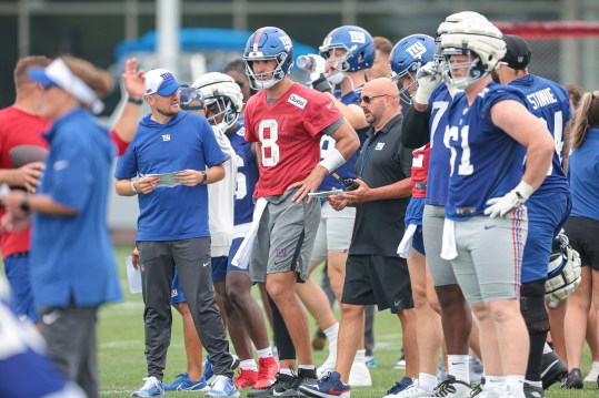 Jul 24, 2024; East Rutherford, NJ, USA; New York Giants quarterback Daniel Jones (8) talks with head coach Brian Dabol during training camp at Quest Diagnostics Training Facility. Mandatory Credit: Vincent Carchietta-USA TODAY Sports