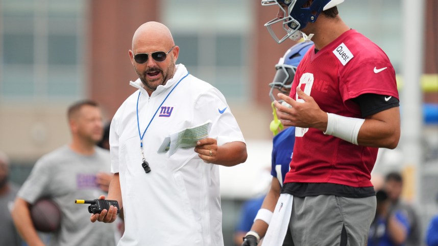 Jul 25, 2024; East Rutherford, NY, USA; New York Giants head coach Brian Daboll speaks with quarterback Daniel Jones (8) during training camp at Quest Diagnostics Training Center. Mandatory Credit: Lucas Boland-USA TODAY Sports