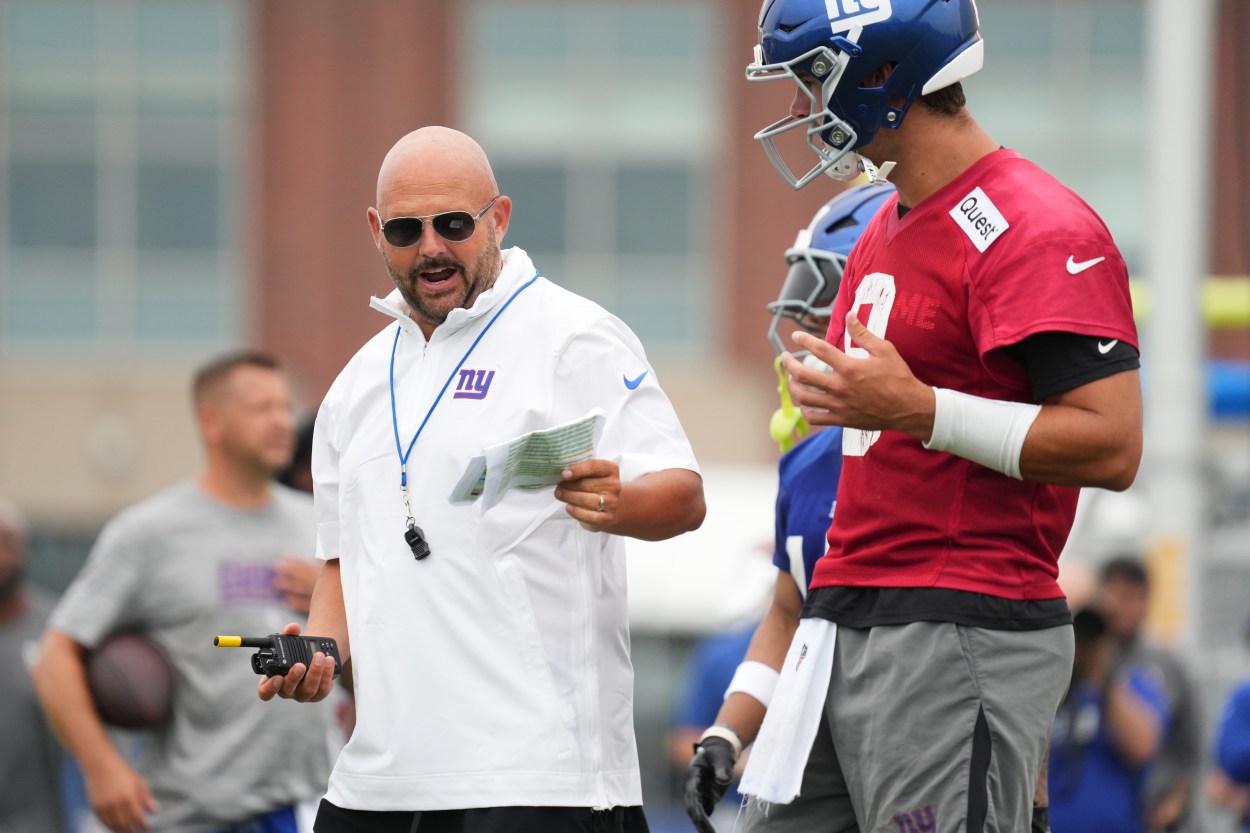 Jul 25, 2024; East Rutherford, NY, USA; New York Giants head coach Brian Daboll speaks with quarterback Daniel Jones (8) during training camp at Quest Diagnostics Training Center. Mandatory Credit: Lucas Boland-USA TODAY Sports