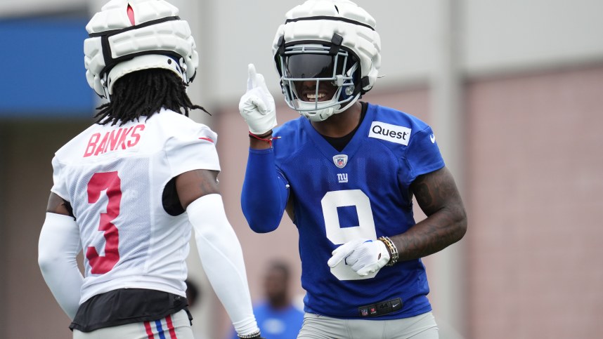 Jul 25, 2024; East Rutherford, NY, USA; New York Giants wide receiver Malik Nabers (9) and cornerback Deonte Banks (3) react after a drill during training camp at Quest Diagnostics Training Center. Mandatory Credit: Lucas Boland-USA TODAY Sports