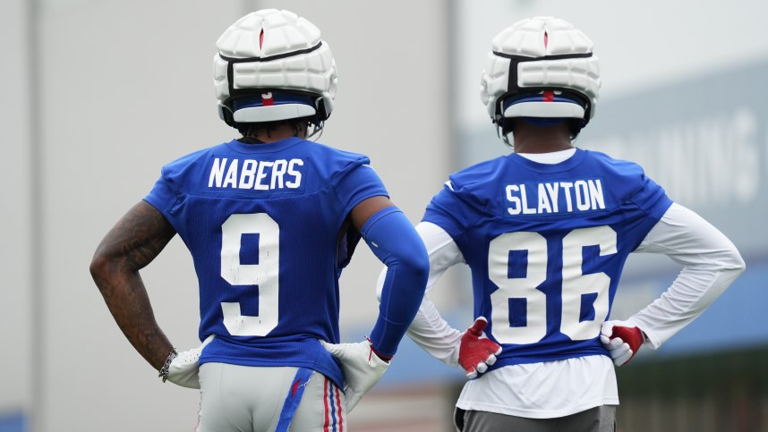 Jul 25, 2024; East Rutherford, NY, USA; New York Giants wide receiver Malik Nabers (9) and wide receiver Darius Slayton (86) look on during training camp at Quest Diagnostics Training Center. Mandatory Credit: Lucas Boland-USA TODAY Sports