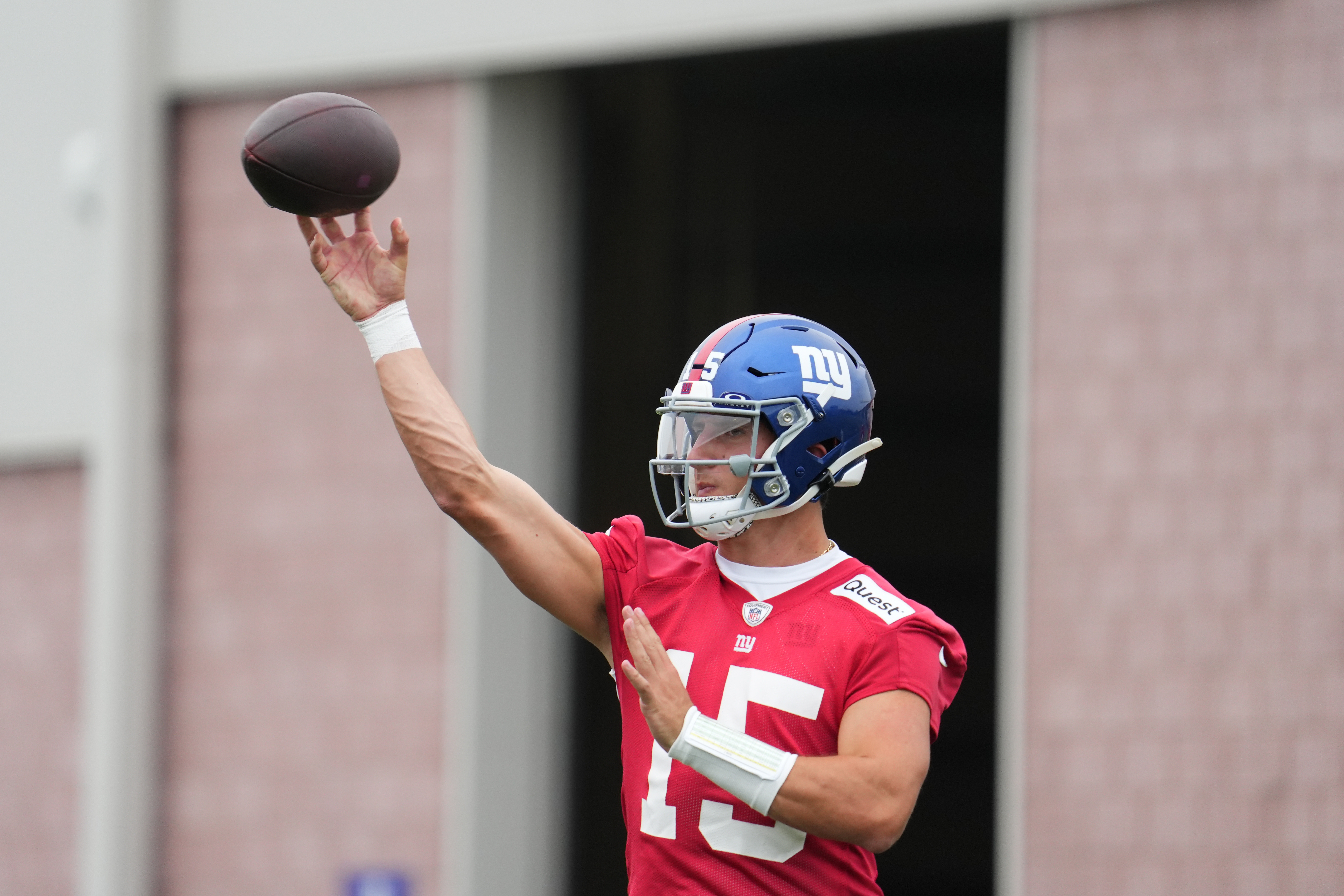 Jul 25, 2024; East Rutherford, NY, USA; New York Giants quarterback Tommy DeVito (15) throws a pass during training camp at Quest Diagnostics Training Center. Mandatory Credit: Lucas Boland-USA TODAY Sports