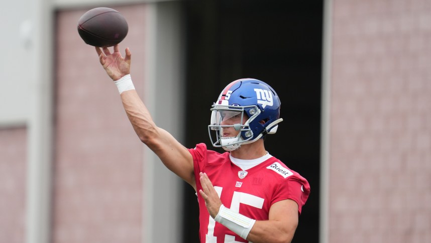 Jul 25, 2024; East Rutherford, NY, USA; New York Giants quarterback Tommy DeVito (15) throws a pass during training camp at Quest Diagnostics Training Center. Mandatory Credit: Lucas Boland-USA TODAY Sports