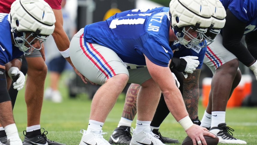 Jul 25, 2024; East Rutherford, NY, USA; New York Giants center John Michael Schmitz Jr. (61) waits to snap the ball during training camp at Quest Diagnostics Training Center. Mandatory Credit: Lucas Boland-USA TODAY Sports