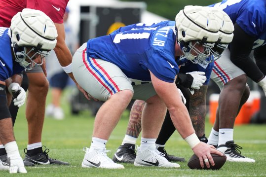 Jul 25, 2024; East Rutherford, NY, USA; New York Giants center John Michael Schmitz Jr. (61) waits to snap the ball during training camp at Quest Diagnostics Training Center. Mandatory Credit: Lucas Boland-USA TODAY Sports