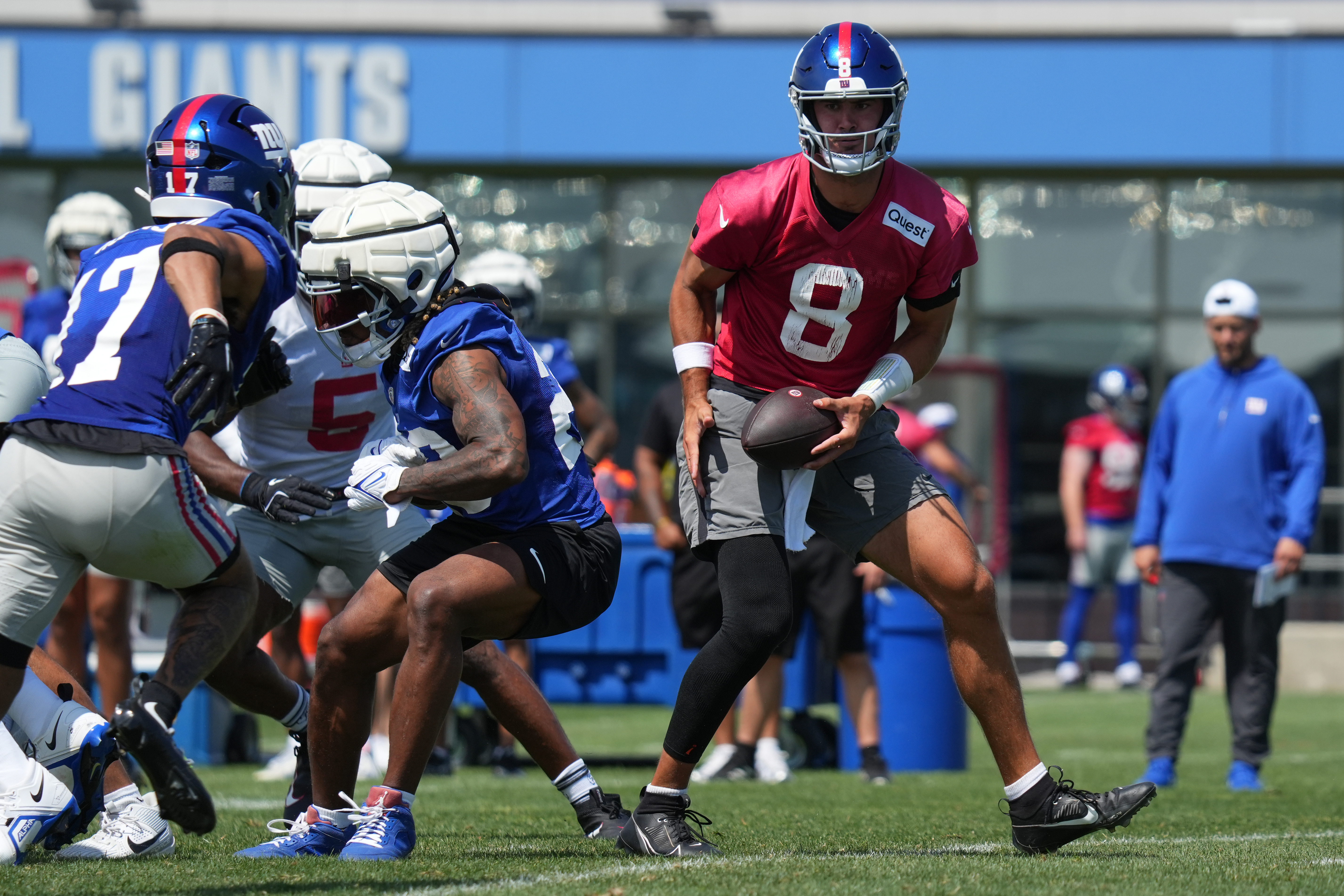 Jul 26, 2024; East Rutherford, NJ, USA; New York Giants quarterback Daniel Jones (8) fakes a handoff during training camp at Quest Diagnostics Training Center. Mandatory Credit: Lucas Boland-USA TODAY Sports