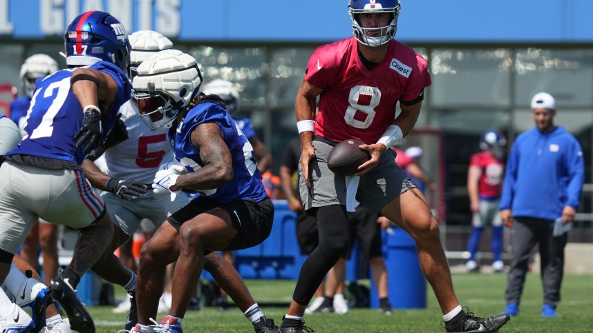 Jul 26, 2024; East Rutherford, NJ, USA; New York Giants quarterback Daniel Jones (8) fakes a handoff during training camp at Quest Diagnostics Training Center. Mandatory Credit: Lucas Boland-USA TODAY Sports