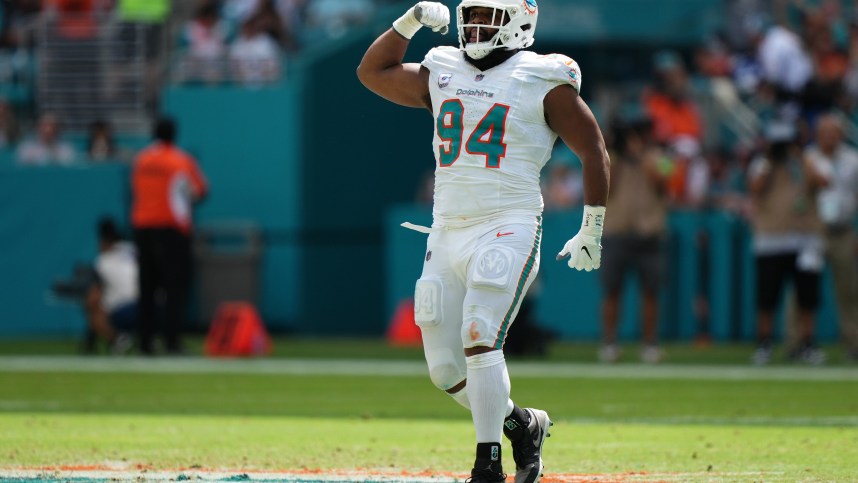 Oct 8, 2023; Miami Gardens, Florida, USA; Miami Dolphins defensive tackle Christian Wilkins (94) celebrates after sacking New York Giants quarterback Daniel Jones (not pictured) during the first half at Hard Rock Stadium. Mandatory Credit: Jasen Vinlove-USA TODAY Sports