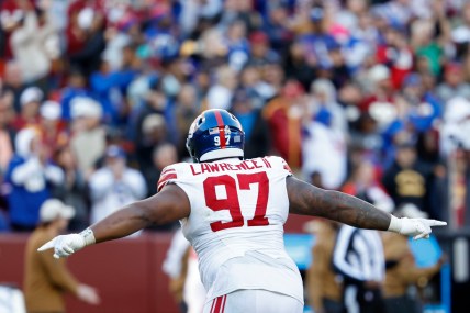 Nov 19, 2023; Landover, Maryland, USA; New York Giants defensive tackle Dexter Lawrence II (97) celebrates after an interception against the Washington Commanders during the fourth quarter at FedExField. Mandatory Credit: Geoff Burke-USA TODAY Sports