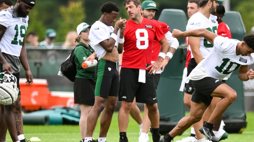 Jul 25, 2024; Florham Park, NJ, USA; New York Jets quarterback Aaron Rodgers (8) talks with wide receiver Garrett Wilson (5) during training camp at Atlantic Health Jets Training Center. Mandatory Credit: John Jones-USA TODAY Sports