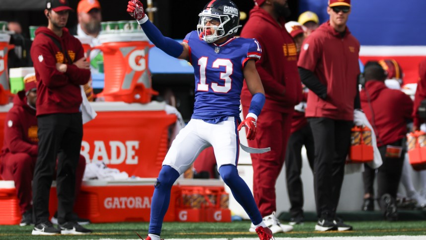 Oct 22, 2023; East Rutherford, New Jersey, USA; New York Giants wide receiver Jalin Hyatt (13) reacts after a first down catch during the first half against the Washington Commanders at MetLife Stadium. Mandatory Credit: Vincent Carchietta-USA TODAY Sports