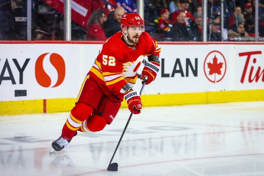 Oct 24, 2023; Calgary, Alberta, CAN; Calgary Flames defenseman MacKenzie Weegar (52) controls the puck against the New York Rangers during the third period at Scotiabank Saddledome. Mandatory Credit: Sergei Belski-USA TODAY Sports