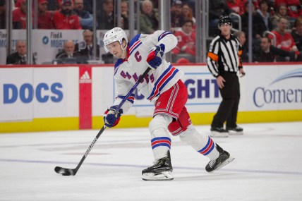 Feb 23, 2023; Detroit, Michigan, USA; New York Rangers defenseman Jacob Trouba (8) shoots the puck during the first period at Little Caesars Arena. Mandatory Credit: Brian Bradshaw Sevald-USA TODAY Sports