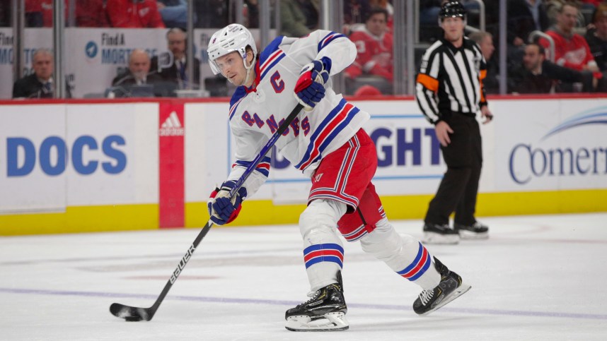 Feb 23, 2023; Detroit, Michigan, USA; New York Rangers defenseman Jacob Trouba (8) shoots the puck during the first period at Little Caesars Arena. Mandatory Credit: Brian Bradshaw Sevald-USA TODAY Sports