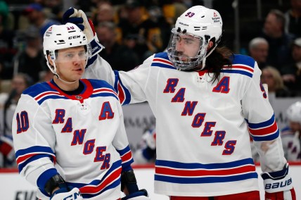Mar 16, 2024; Pittsburgh, Pennsylvania, USA;  New York Rangers left wing Artemi Panarin (10) and center Mika Zibanejad (93) talk on the ice against the Pittsburgh Penguins during the second period at PPG Paints Arena. Mandatory Credit: Charles LeClaire-USA TODAY Sports