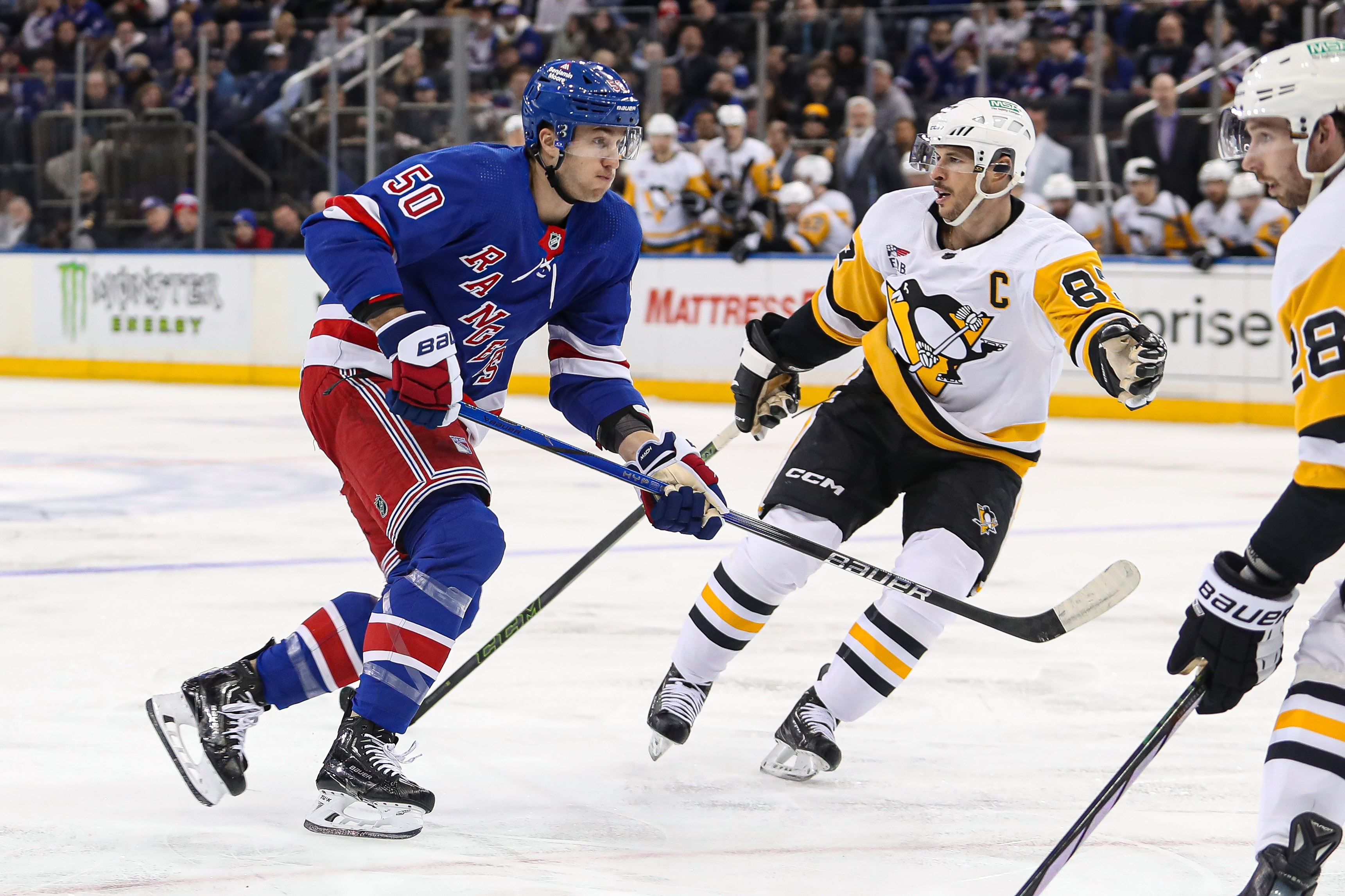 Apr 1, 2024; New York, New York, USA; New York Rangers left wing Will Cuylle (50) and Pittsburgh Penguins center Sidney Crosby (87) battle for position during the second period at Madison Square Garden. Mandatory Credit: Danny Wild-USA TODAY Sports