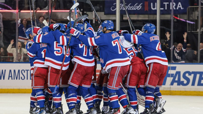 May 24, 2024; New York, New York, USA; New York Rangers center Barclay Goodrow (21) celebrates his game-winning overtime goal with teammates in game two of the Eastern Conference Final of the 2024 Stanley Cup Playoffs against the Florida Panthers at Madison Square Garden. Mandatory Credit: Vincent Carchietta-USA TODAY Sports