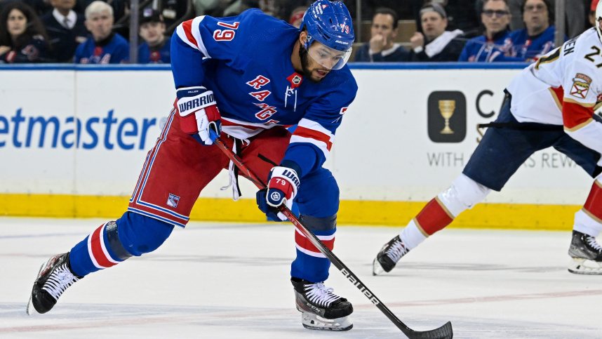 May 30, 2024; New York, New York, USA; New York Rangers defenseman K'Andre Miller (79) skates across center ice against the Florida Panthers during the first period in game five of the Eastern Conference Final of the 2024 Stanley Cup Playoffs at Madison Square Garden. Mandatory Credit: Dennis Schneidler-USA TODAY Sports