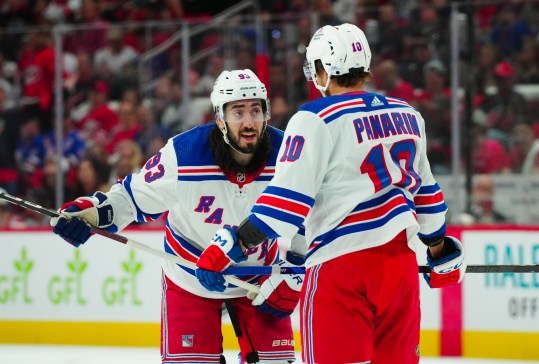 May 9, 2024; Raleigh, North Carolina, USA; New York Rangers center Mika Zibanejad (93) and left wing Artemi Panarin (10) talks against the Carolina Hurricanes during the second period in game three of the second round of the 2024 Stanley Cup Playoffs at PNC Arena. Mandatory Credit: James Guillory-USA TODAY Sports