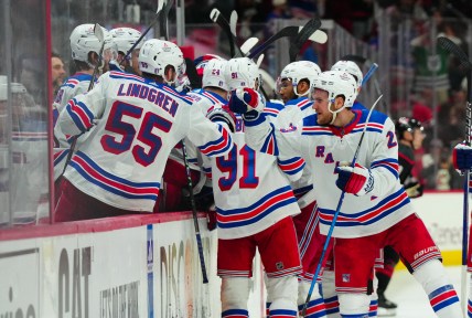 May 16, 2024; Raleigh, North Carolina, USA; New York Rangers defenseman Adam Fox (23) and defenseman Ryan Lindgren (55) celebrate center Barclay Goodrow (21) (not shown) goal against the Carolina Hurricanes during the third period in game six of the second round of the 2024 Stanley Cup Playoffs at PNC Arena. Mandatory Credit: James Guillory-USA TODAY Sports
