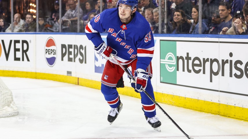 Apr 21, 2024; New York, New York, USA; New York Rangers defenseman Ryan Lindgren (55) controls the puck in the third period against the Washington Capitals in game one of the first round of the 2024 Stanley Cup Playoffs at Madison Square Garden. Mandatory Credit: Wendell Cruz-USA TODAY Sports