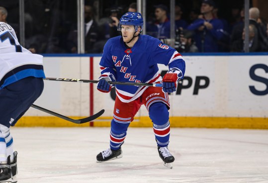 Mar 19, 2024; New York, New York, USA; New York Rangers defenseman Chad Ruhwedel (5) skates in his Rangers debut during the second period against the Winnipeg Jets at Madison Square Garden. Mandatory Credit: Danny Wild-USA TODAY Sports