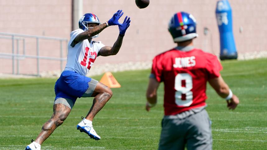 New York Giants quarterback Daniel Jones (8) throws to wide receiver Darren Waller (12) during organized team activities (OTA's) at the Giants training center on Wednesday, May 31, 2023, in East Rutherford.