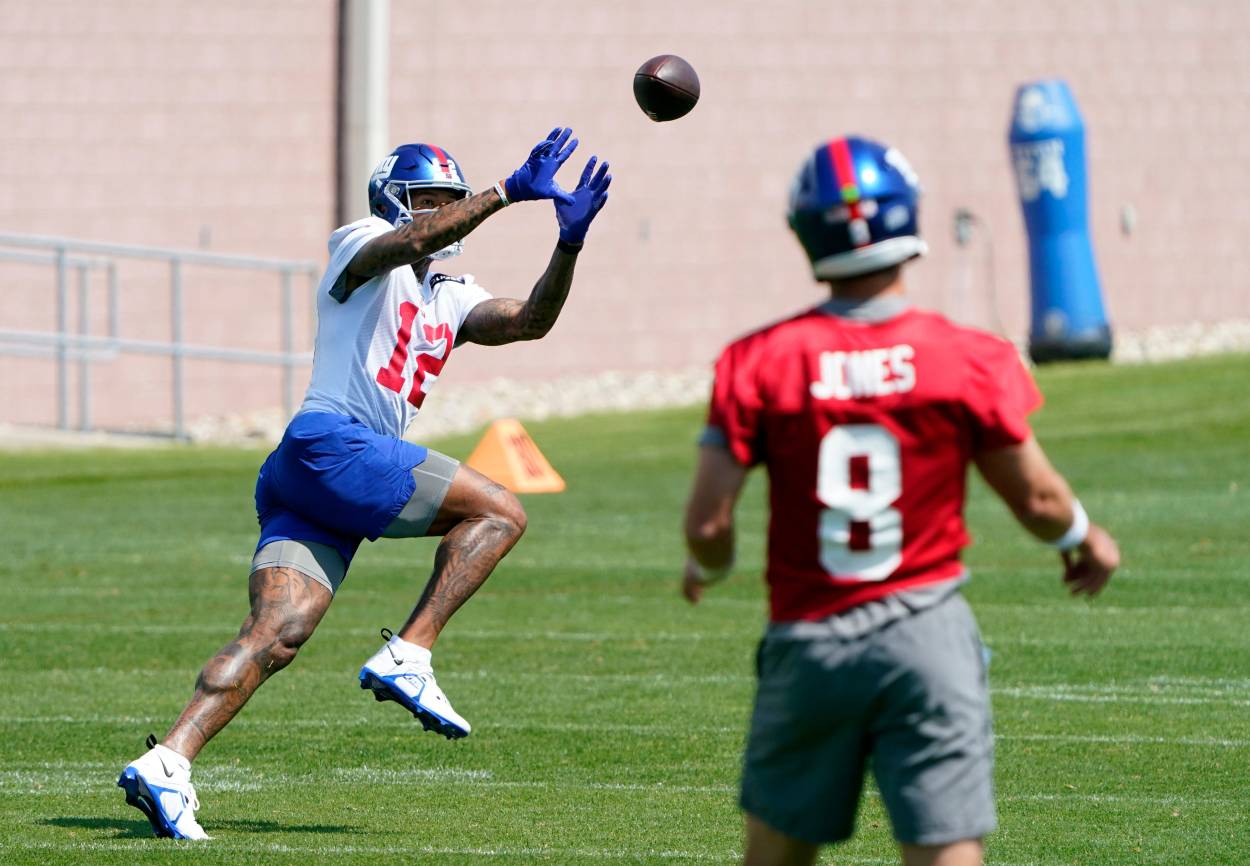 New York Giants quarterback Daniel Jones (8) throws to wide receiver Darren Waller (12) during organized team activities (OTA's) at the Giants training center on Wednesday, May 31, 2023, in East Rutherford.