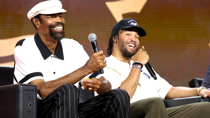 NEW YORK, NEW YORK (KNICKS) - AUGUST 16: (L-R) Walt Frazier and Jalen Brunson speak onstage at the Fanatics Fest NYC 2024 at Jacob Javits Center on August 16, 2024 in New York City. (Photo by Kevin Mazur/Getty Images for Fanatics)