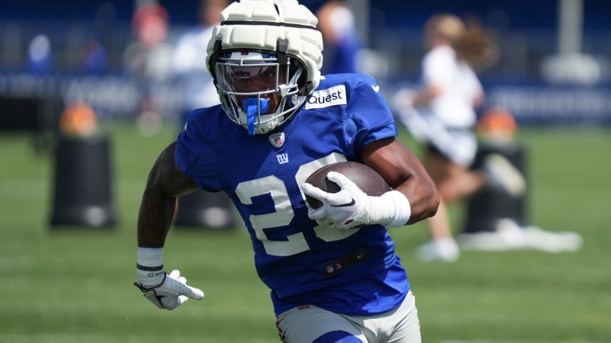 Jul 26, 2024; East Rutherford, NJ, USA; New York Giants running back Tyrone Tracy Jr. (29) carries a ball during training camp at Quest Diagnostics Training Center. Mandatory Credit: Lucas Boland-USA TODAY Sports