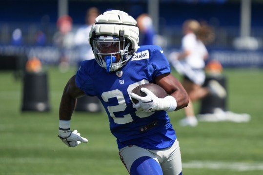 July 26, 2024; East Rutherford, NJ, USA; New York Giants running back Tyrone Tracy Jr. (29) carries a ball during training camp at Quest Diagnostics Training Center. Mandatory Photo Credit: Lucas Boland-USA TODAY Sports