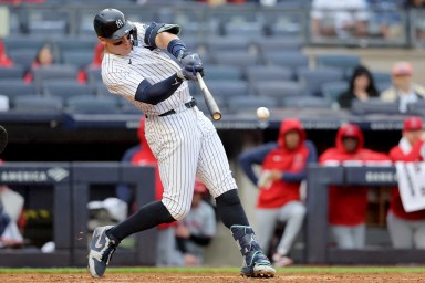 Aug 7, 2024; Bronx, New York, USA; New York Yankees designated hitter Aaron Judge (99) hits an RBI single against the Los Angeles Angels during the fourth inning at Yankee Stadium. Mandatory Credit: Brad Penner-USA TODAY Sports