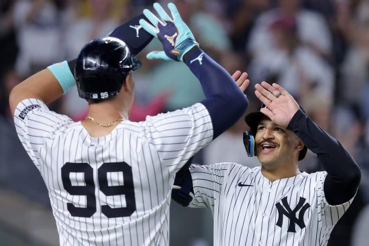 Jun 9, 2024; Bronx, New York, USA; New York Yankees center fielder Trent Grisham (12) celebrates his three run home run against the Los Angeles Dodgers with right fielder Aaron Judge (99) during the sixth inning at Yankee Stadium. Mandatory Credit: Brad Penner-USA TODAY Sports