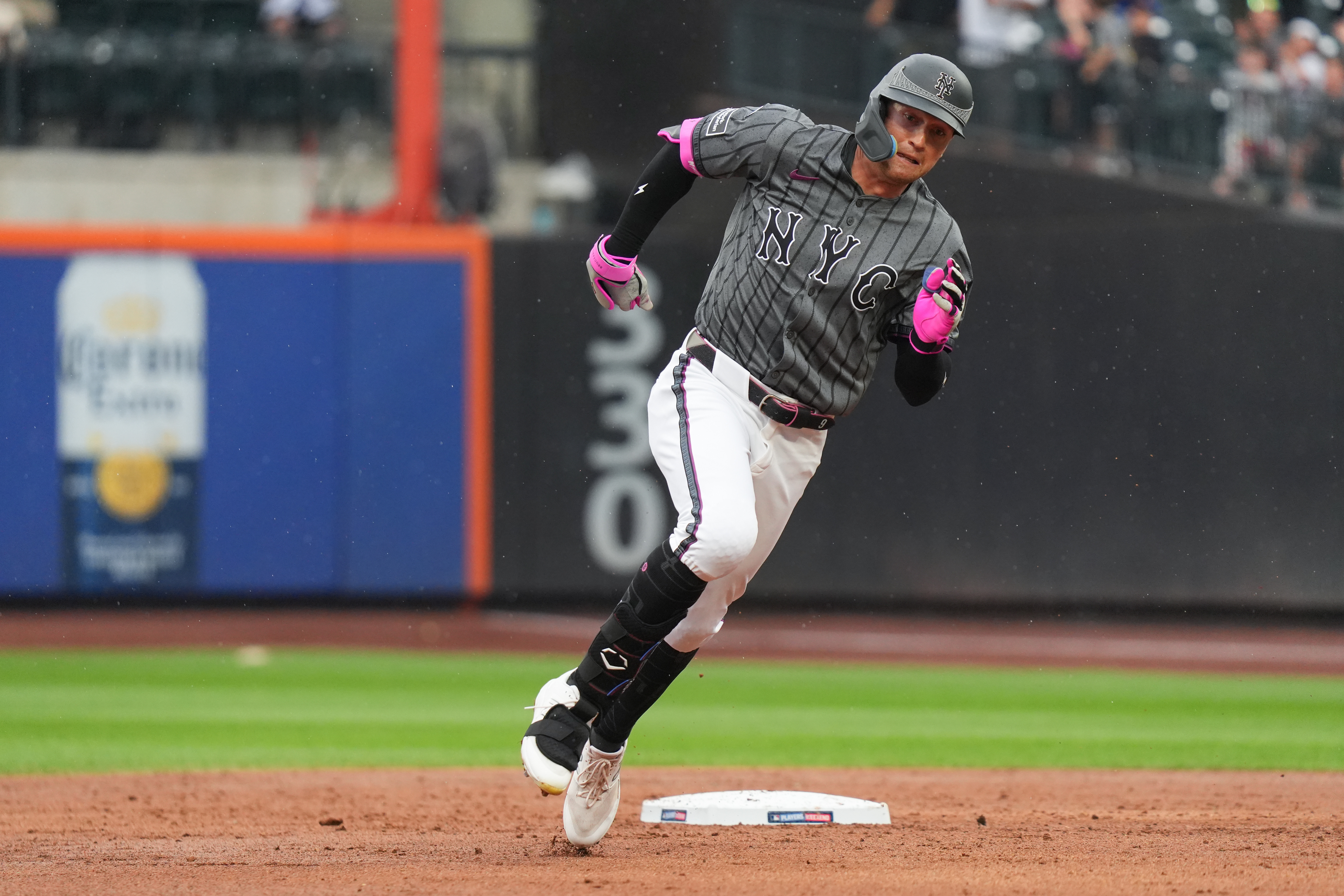 Aug 17, 2024; New York City, New York, USA; New York Mets left fielder Brandon Nimmo (9) rounds second base during the game against the Miami Marlins at Citi Field. Mandatory Credit: Lucas Boland-USA TODAY Sports