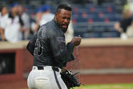 Aug 17, 2024; New York City, New York, USA; New York Mets pitcher Luis Severino (40) shakes off water after being doused by teammates following a shutout against the Miami Marlins at Citi Field. Mandatory Credit: Lucas Boland-USA TODAY Sports