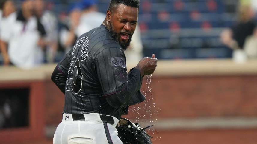 Aug 17, 2024; New York City, New York, USA; New York Mets pitcher Luis Severino (40) shakes off water after being doused by teammates following a shutout against the Miami Marlins at Citi Field. Mandatory Credit: Lucas Boland-USA TODAY Sports