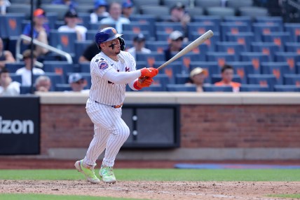 Jul 31, 2024; New York City, New York, USA; New York Mets catcher Francisco Alvarez (4) follows through on an RBI ground out during the ninth inning against the Minnesota Twins at Citi Field. Mandatory Credit: Brad Penner-USA TODAY Sports