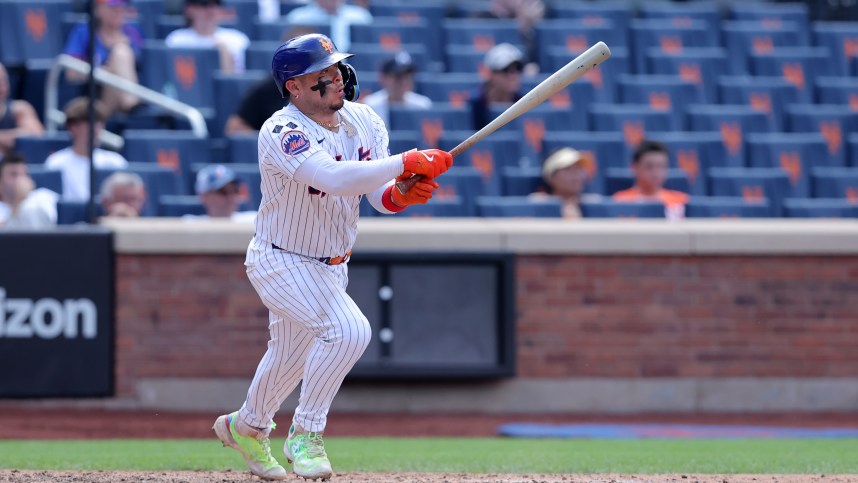 Jul 31, 2024; New York City, New York, USA; New York Mets catcher Francisco Alvarez (4) follows through on an RBI ground out during the ninth inning against the Minnesota Twins at Citi Field. Mandatory Credit: Brad Penner-USA TODAY Sports