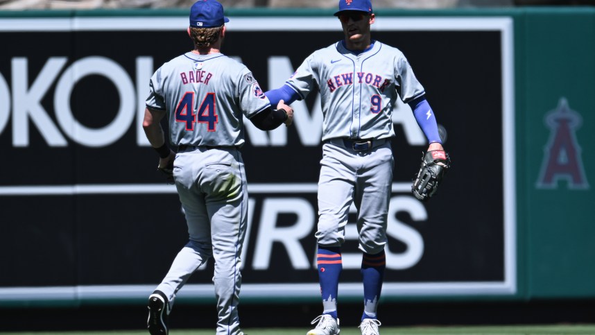 Aug 4, 2024; Anaheim, California, USA; during the New York Mets outfielder Harrison Bader (44) celebrates with outfielder Brandon Nimmo (9) after making a catch during the fifth inning at Angel Stadium. Mandatory Credit: Jonathan Hui-USA TODAY Sports