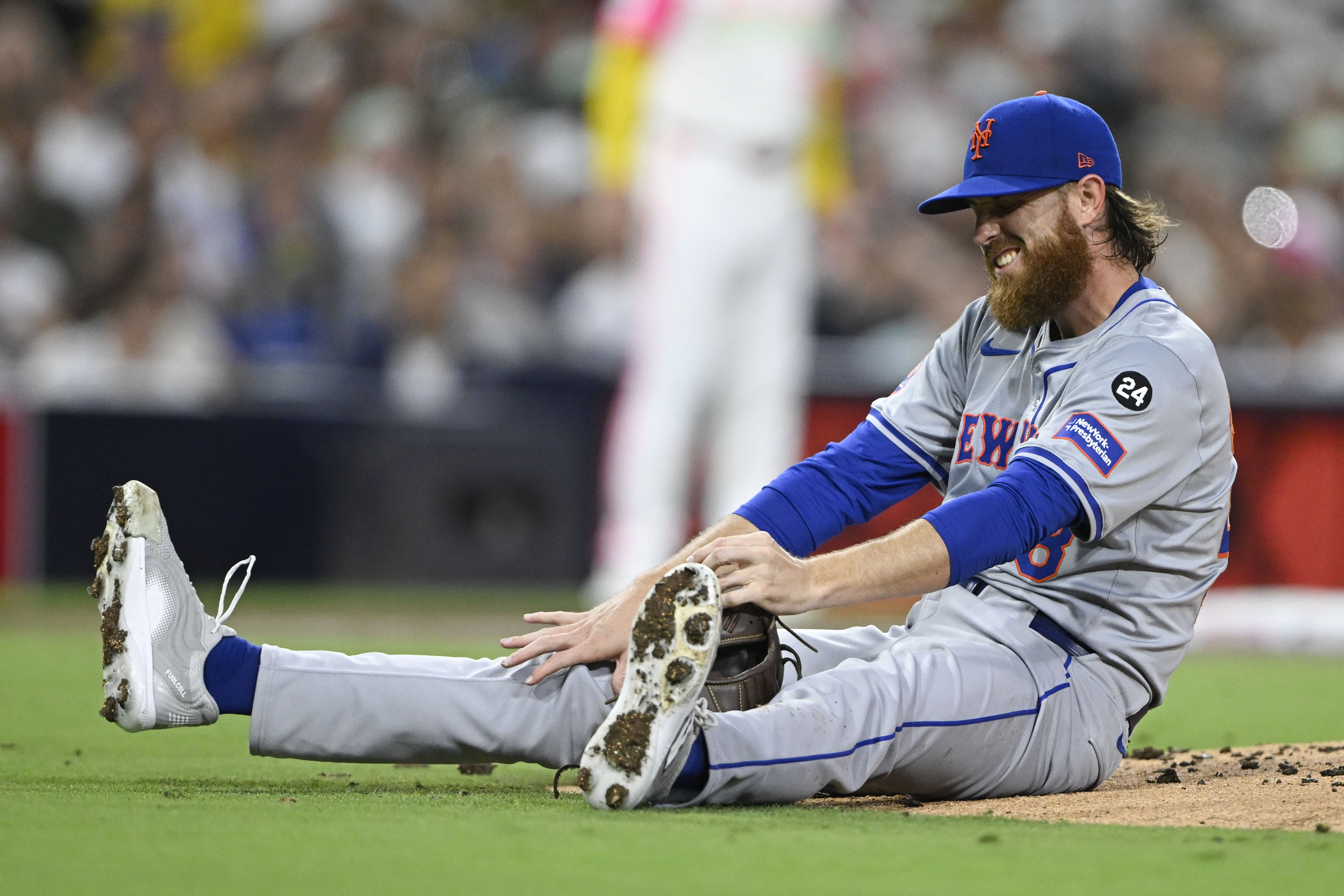 Aug 23, 2024; San Diego, California, USA; New York Mets starting pitcher Paul Blackburn (58) reacts after being hit during the third inning against the San Diego Padres at Petco Park. Mandatory Credit: Denis Poroy-USA TODAY Sports