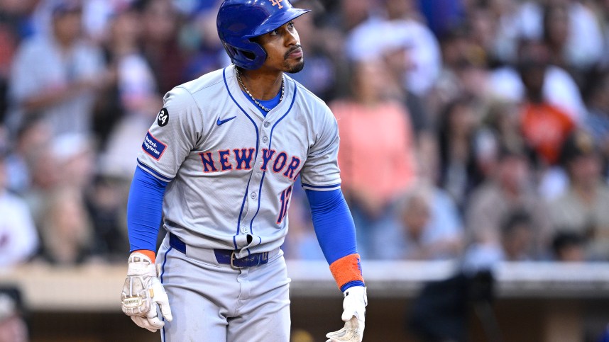 Aug 24, 2024; San Diego, California, USA; New York Mets shortstop Francisco Lindor (12) hits a grand slam home run against the San Diego Padres during the fourth inning at Petco Park. Mandatory Credit: Orlando Ramirez-USA TODAY Sports