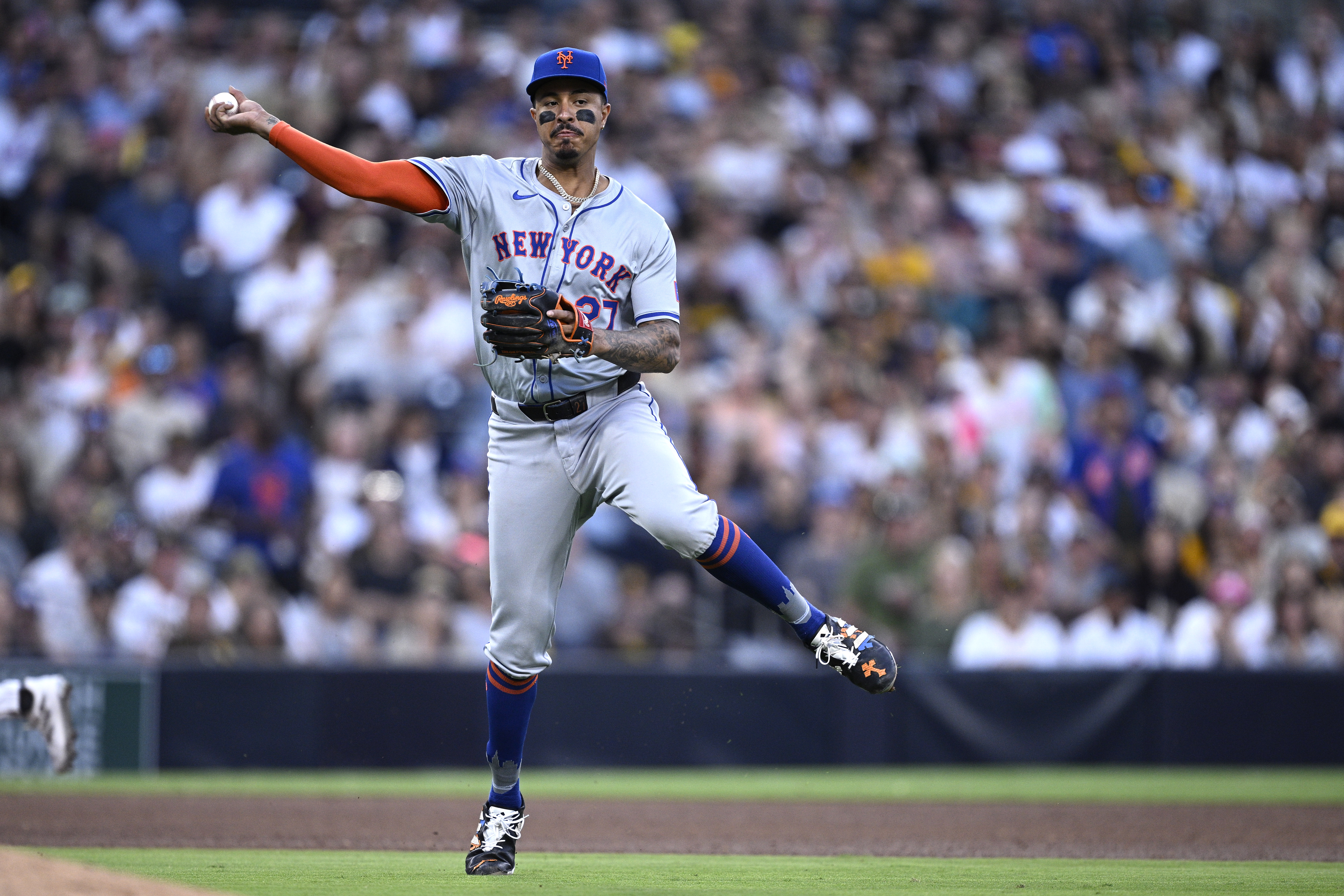 Aug 24, 2024; San Diego, California, USA; New York Mets third baseman Mark Vientos (27) throws to first base on a ground out by San Diego Padres first baseman Luis Arraez (not pictured) during the fifth inning at Petco Park. Mandatory Credit: Orlando Ramirez-USA TODAY Sports