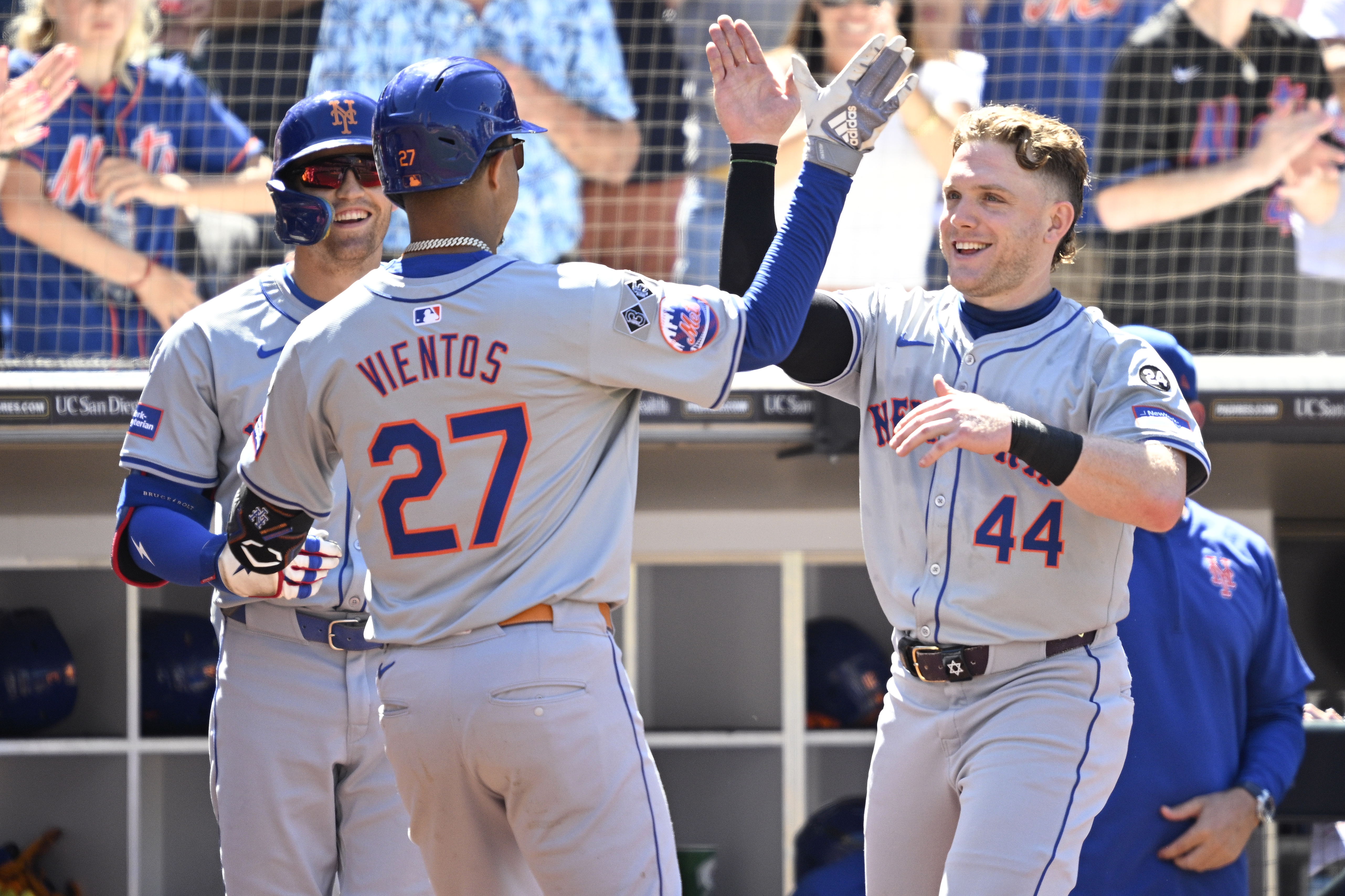 Aug 25, 2024; San Diego, California, USA; New York Mets third baseman Mark Vientos (27) is congratulated by center fielder Harrison Bader (44) after hitting a home run against the San Diego Padres during the seventh inning at Petco Park. Mandatory Credit: Orlando Ramirez-USA TODAY Sports