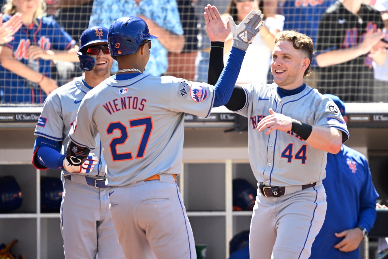 Aug 25, 2024; San Diego, California, USA; New York Mets third baseman Mark Vientos (27) is congratulated by center fielder Harrison Bader (44) after hitting a home run against the San Diego Padres during the seventh inning at Petco Park. Mandatory Credit: Orlando Ramirez-USA TODAY Sports