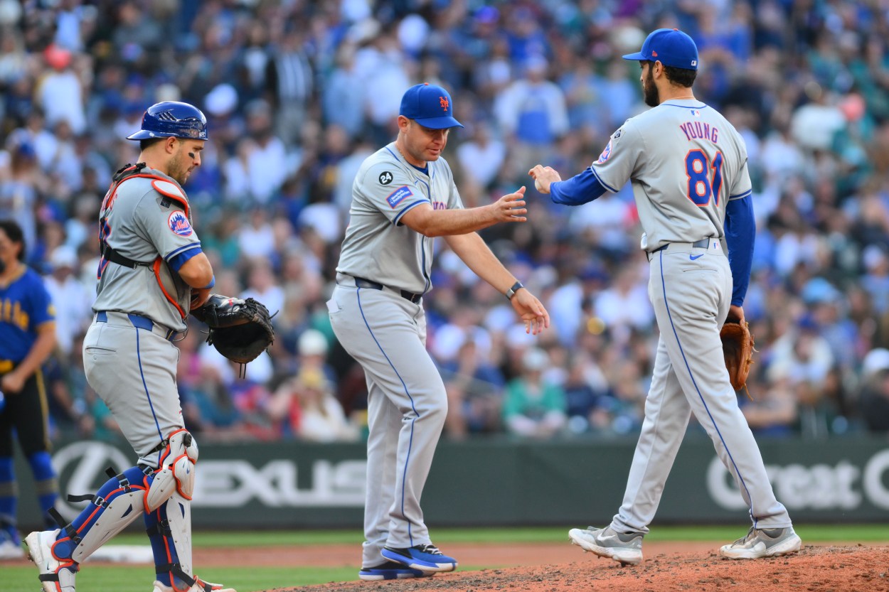 Aug 11, 2024; Seattle, Washington, USA; New York Mets manager Carlos Mendoza (64) pulls relief pitcher Danny Young (81) from the game during the seventh inning against the Seattle Mariners at T-Mobile Park. Mandatory Credit: Steven Bisig-USA TODAY Sports