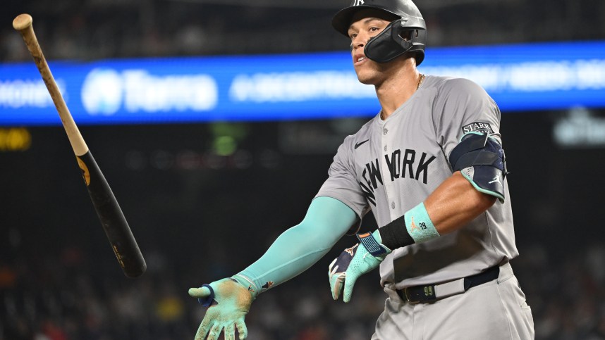 Aug 28, 2024; Washington, District of Columbia, USA; New York Yankees center fielder Aaron Judge (99) tosses his bat after drawing a walk against the Washington Nationals during the eighth inning at Nationals Park. Mandatory Credit: Rafael Suanes-USA TODAY Sports