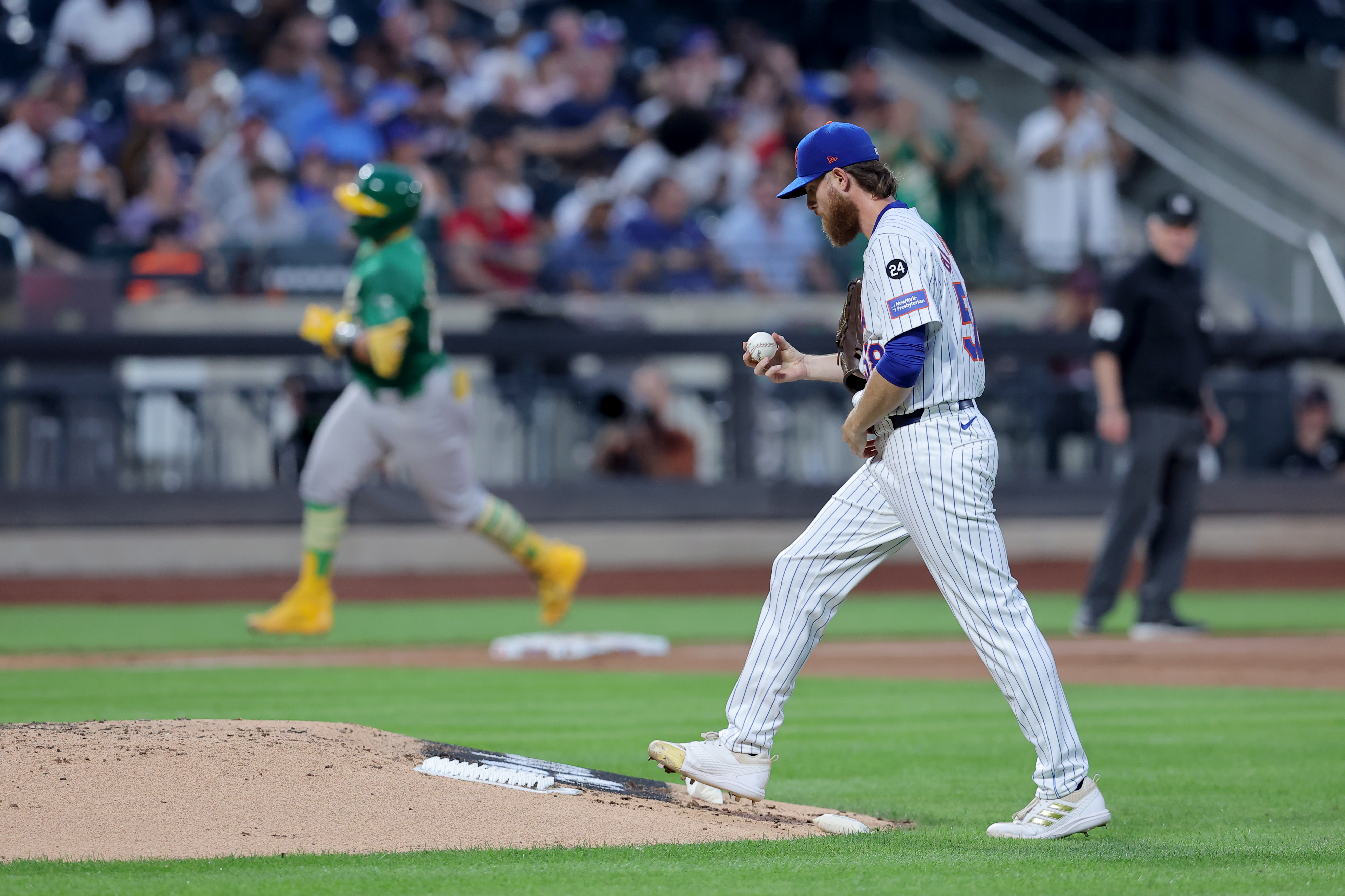 Aug 13, 2024; New York City, New York, USA; New York Mets starting pitcher Paul Blackburn (58) reacts after giving up a three run home run to Oakland Athletics catcher Shea Langeliers (23) during the third inning at Citi Field. Mandatory Credit: Brad Penner-USA TODAY Sports