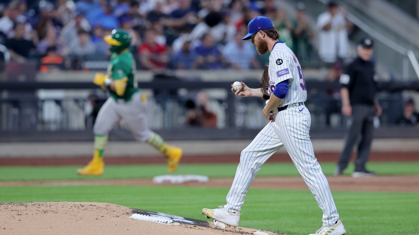 Aug 13, 2024; New York City, New York, USA; New York Mets starting pitcher Paul Blackburn (58) reacts after giving up a three run home run to Oakland Athletics catcher Shea Langeliers (23) during the third inning at Citi Field. Mandatory Credit: Brad Penner-USA TODAY Sports