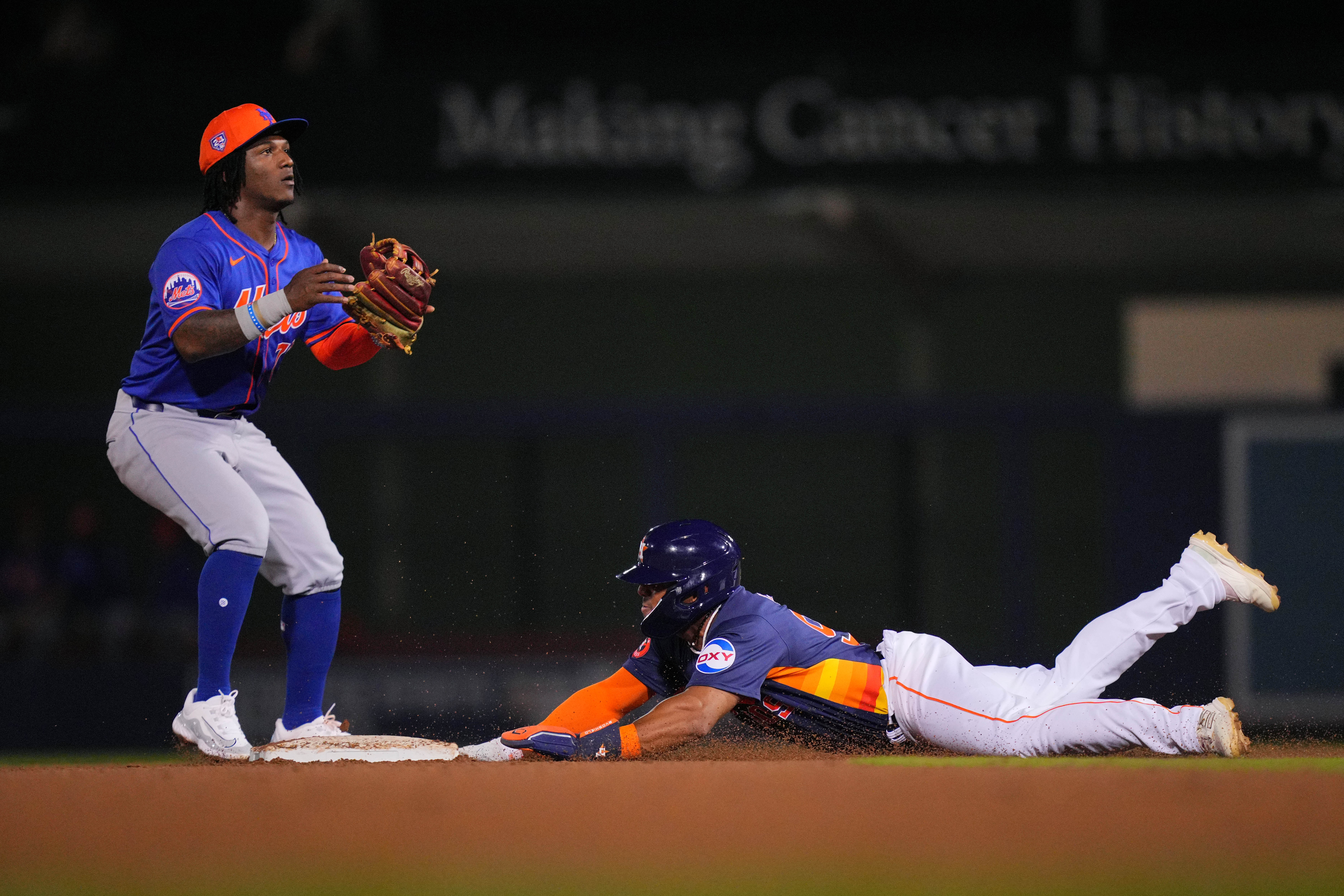 Feb 29, 2024; West Palm Beach, Florida, USA;  Houston Astros outfielder Pedro Leon steals second base as New York Mets second baseman Luisangel Acuna (73) waits for the ball in the seventh inning at The Ballpark of the Palm Beaches. Mandatory Credit: Jim Rassol-USA TODAY Sports